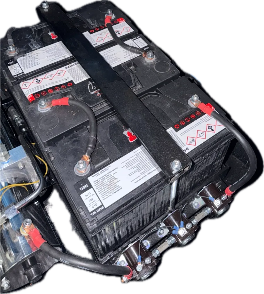 A hardlined trunk battery rack from one of the shop's lowriders