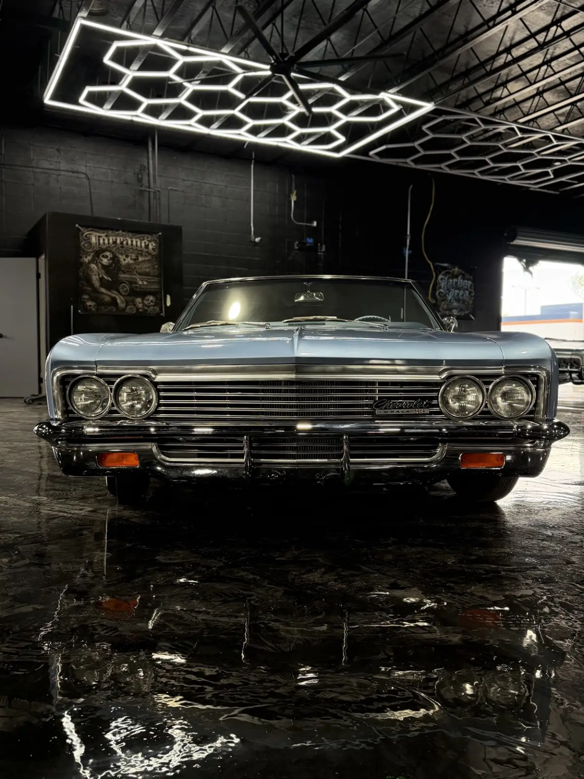 Diamante, a 1966 Impala SS, under the hex lights inside the shop